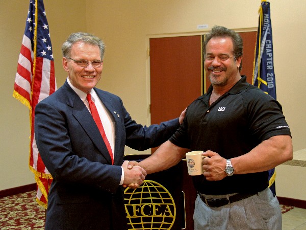 Mark Witzel (l), chapter president, thanks Dr. Scott Wells, co-founder of the Ultimate Knowledge Institute, following his presentation at the April luncheon.